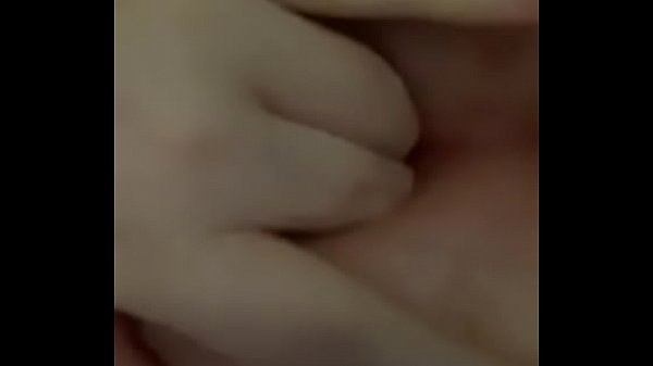 Woman fingers herself to orgasm